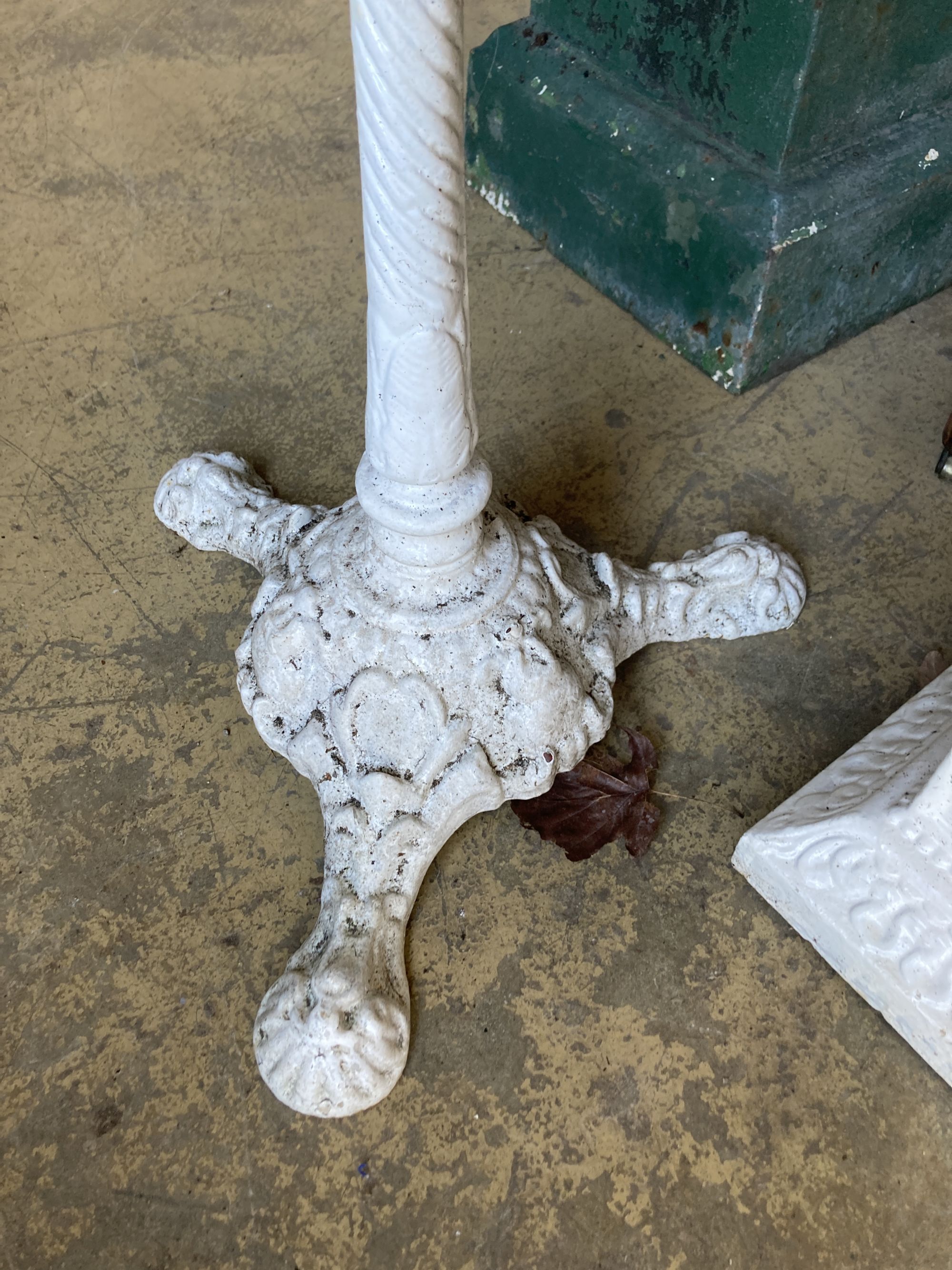 A Victorian marble topped cast iron garden table, diameter 50cm, height 72cm